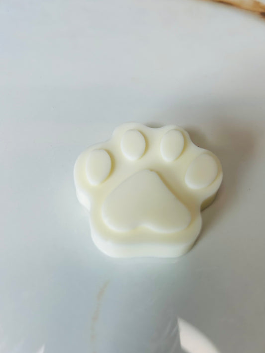 Soap shaped like a paw print on a white surface